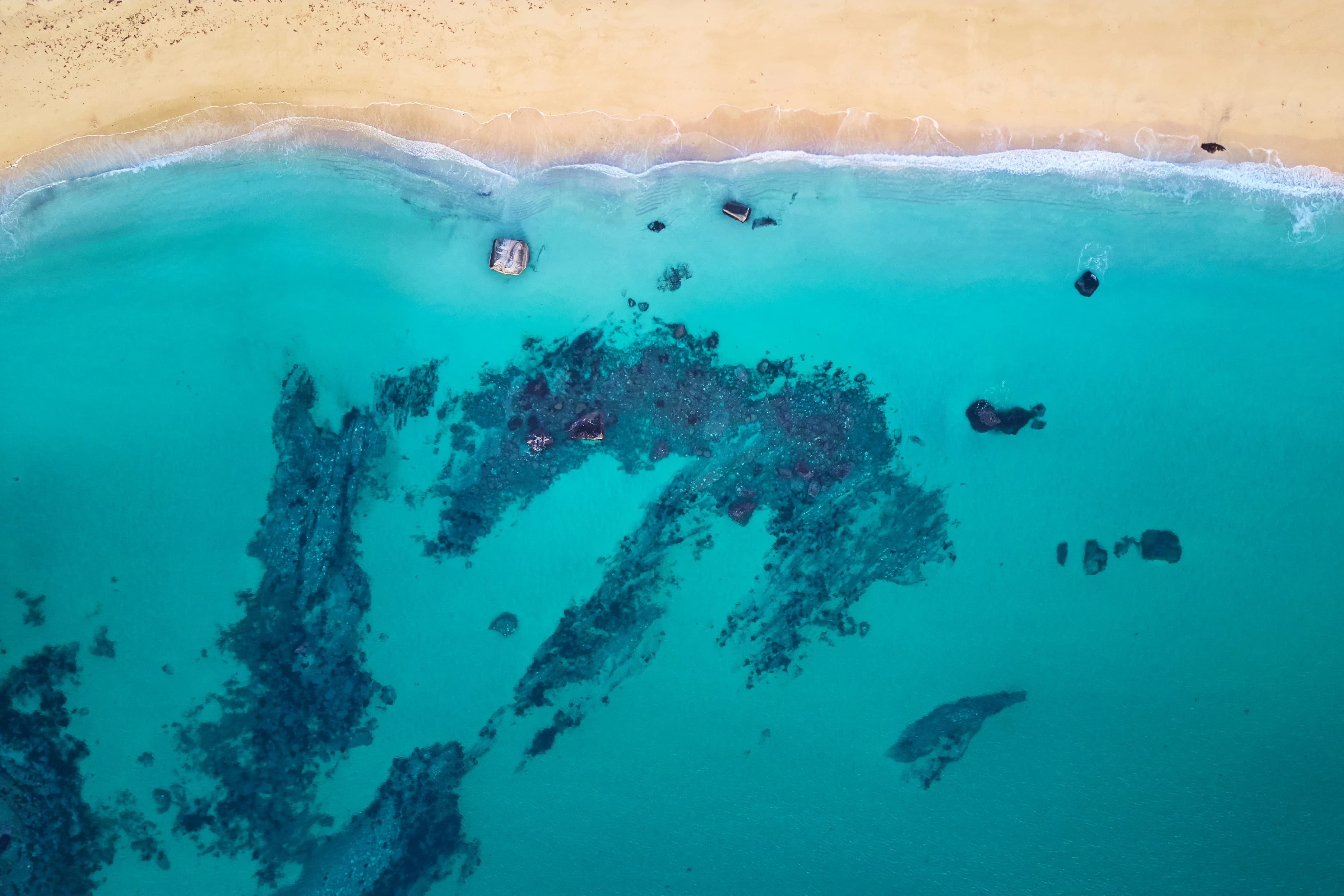 Aerial view of a turquoise bay